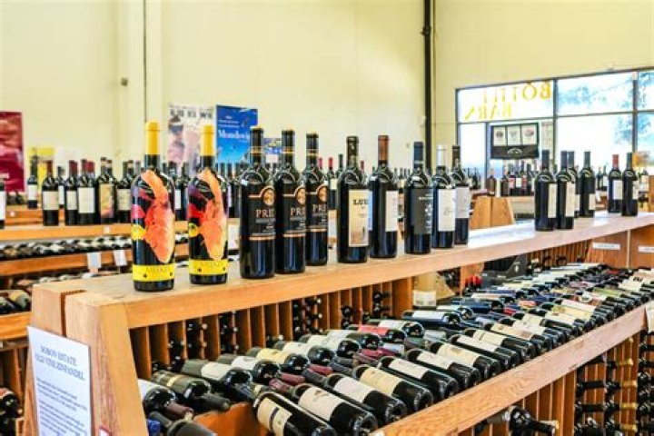 Why does Sydney go to the wine shop in Chapter 12